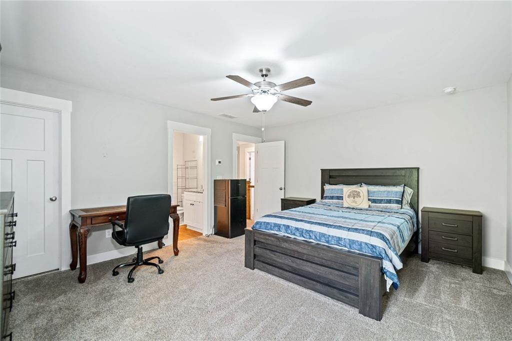 2 Village Ridge Jasper, GA 30143 - Photo 33 of 45 a bedroom with a bed a chair and a chandelier