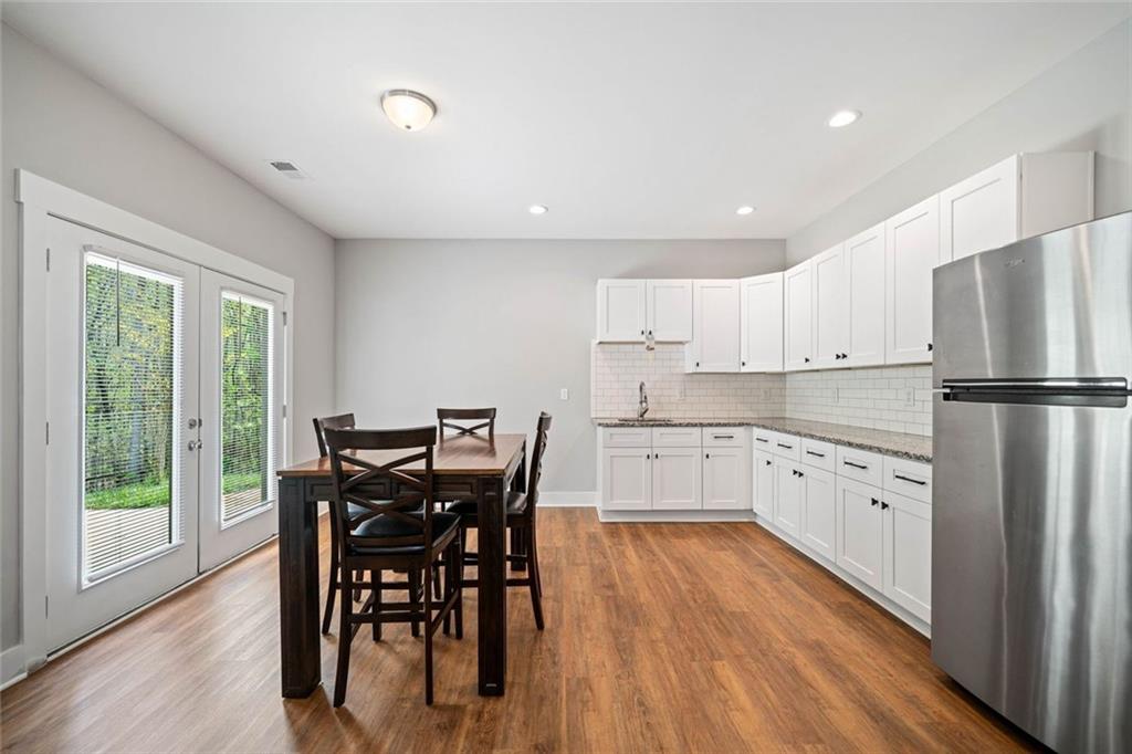 2 Village Ridge Jasper, GA 30143 - Photo 38 of 45 a kitchen with white cabinets stainless steel appliances and wooden floor