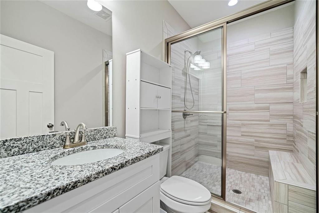 2 Village Ridge Jasper, GA 30143 - Photo 42 of 45 a bathroom with a granite countertop sink toilet and shower