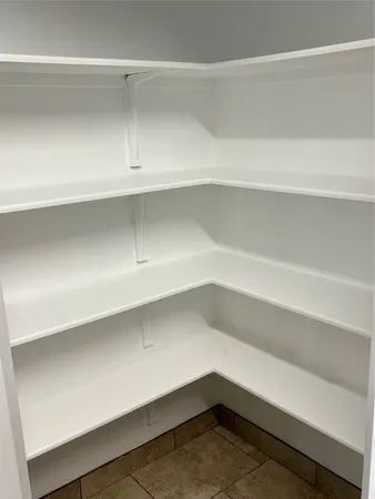 a storage room with wooden floor