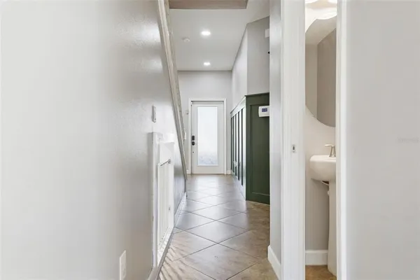 a bathroom with a sink a mirror and toilet