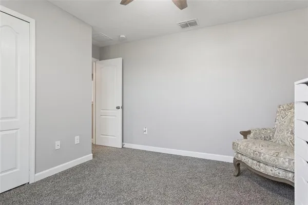 a view of a hallway and chair
