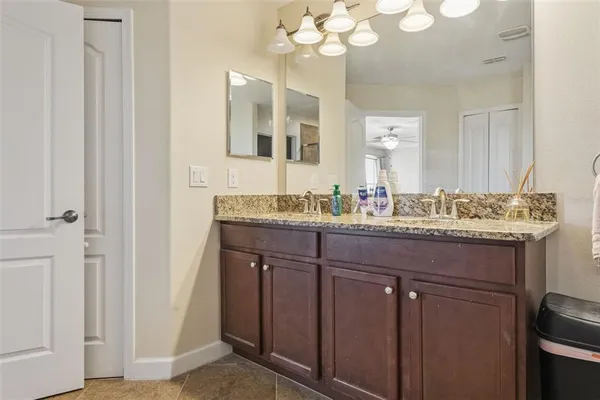 a bathroom with a glass shower door