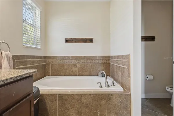 a view of a kitchen cabinets and empty room