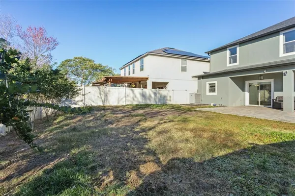 a front view of house with a garden