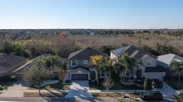 an aerial view of a house with a swimming pool