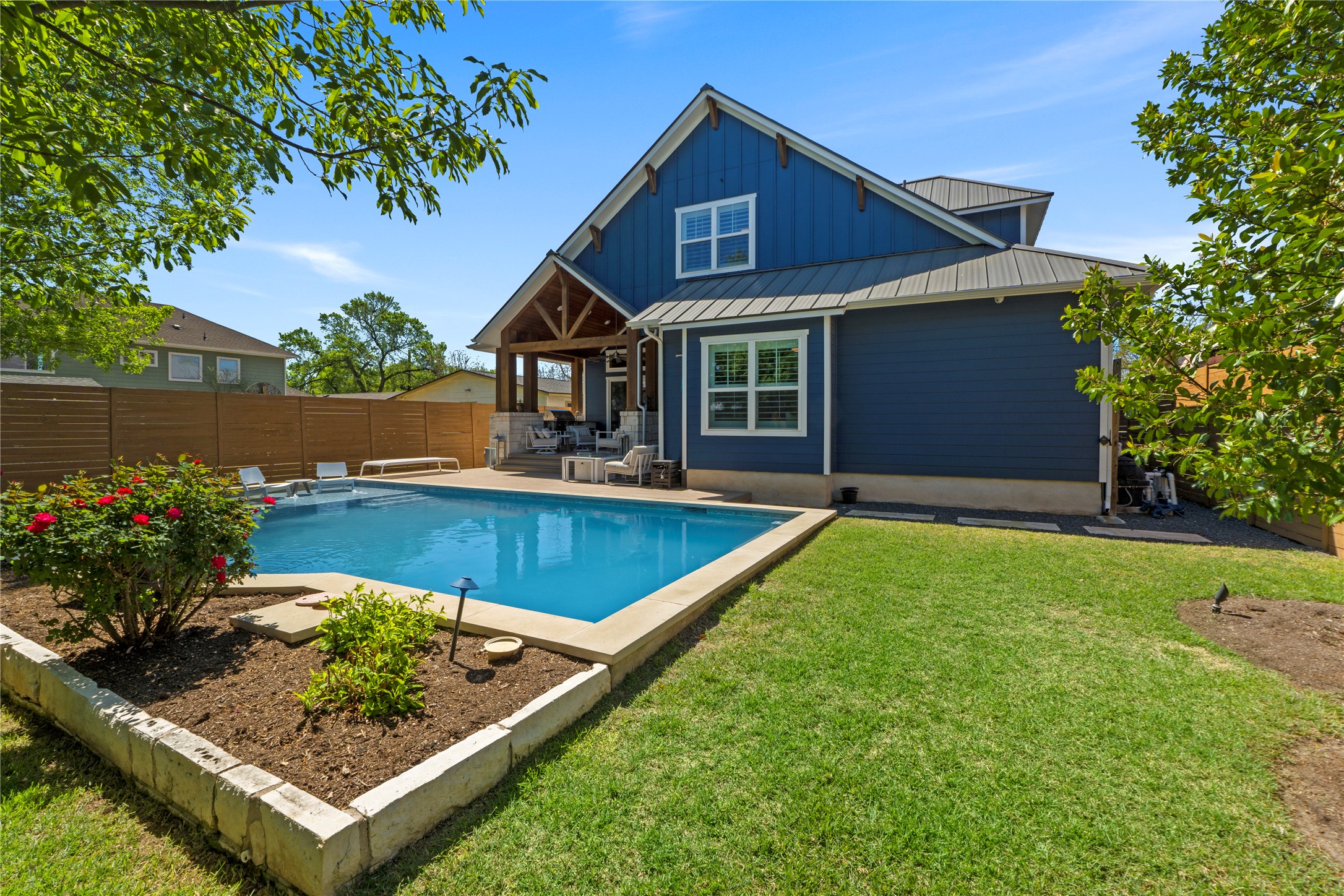 a front view of house with yard and outdoor seating