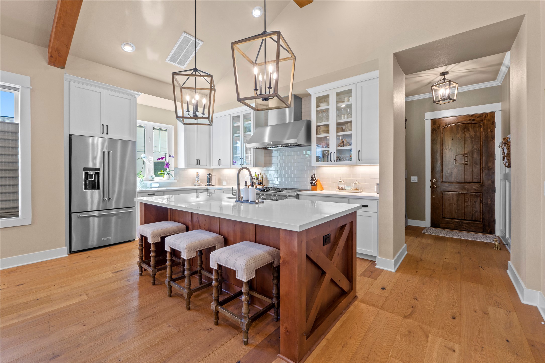 2004 Alegria Road Austin, TX 78757 - Photo 10 of 40 a kitchen with stainless steel appliances granite countertop a dining table chairs refrigerator and chandelier