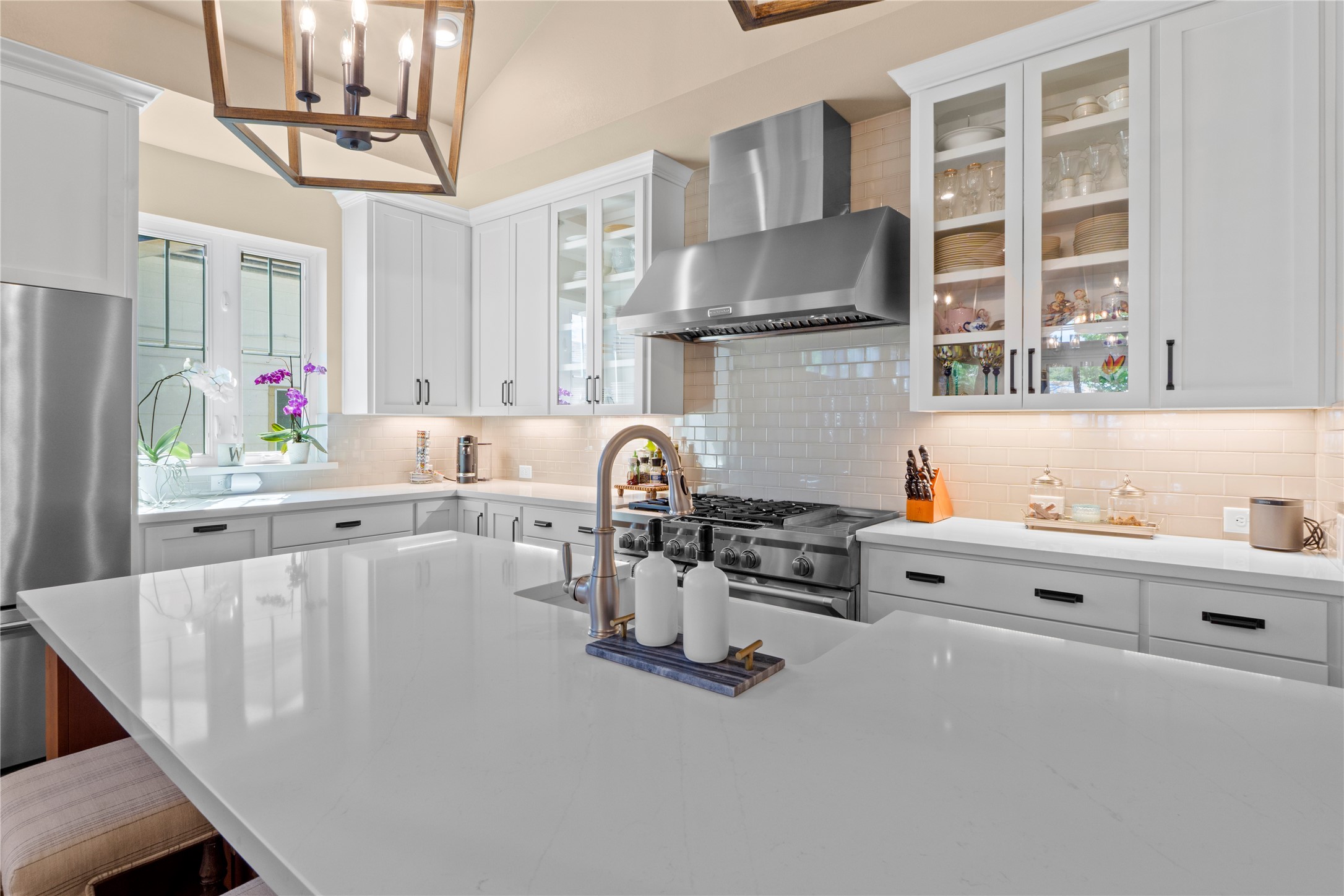 2004 Alegria Road Austin, TX 78757 - Photo 12 of 40 a kitchen with stainless steel appliances a sink a stove and a wooden cabinets