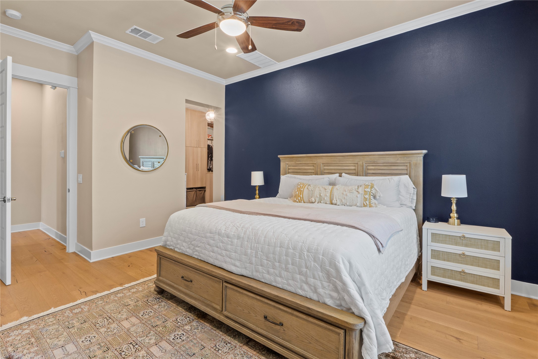 2004 Alegria Road Austin, TX 78757 - Photo 18 of 40 a bedroom with a bed and a chandelier