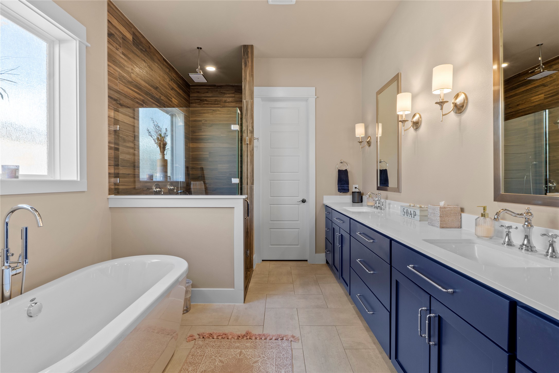 2004 Alegria Road Austin, TX 78757 - Photo 19 of 40 a bathroom with a tub sink and mirror