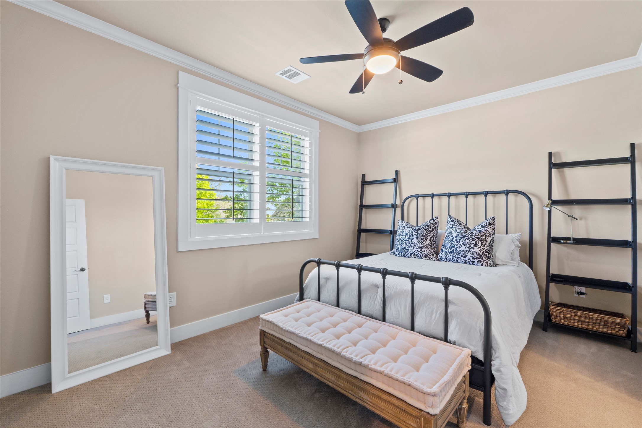 2004 Alegria Road Austin, TX 78757 - Photo 29 of 40 a bedroom with a bed and a ceiling fan