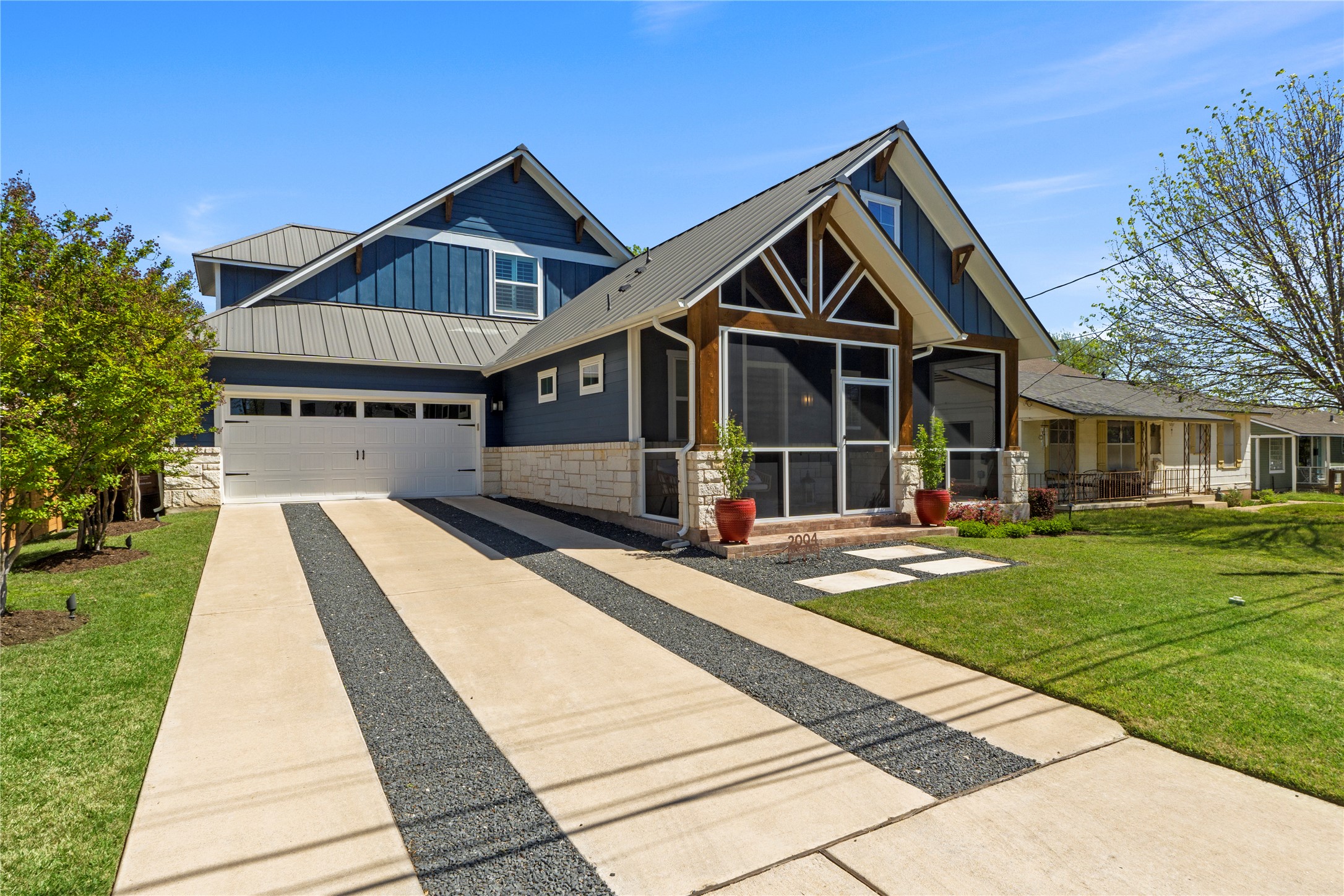 2004 Alegria Road Austin, TX 78757 - Photo 3 of 40 a front view of a house with a yard