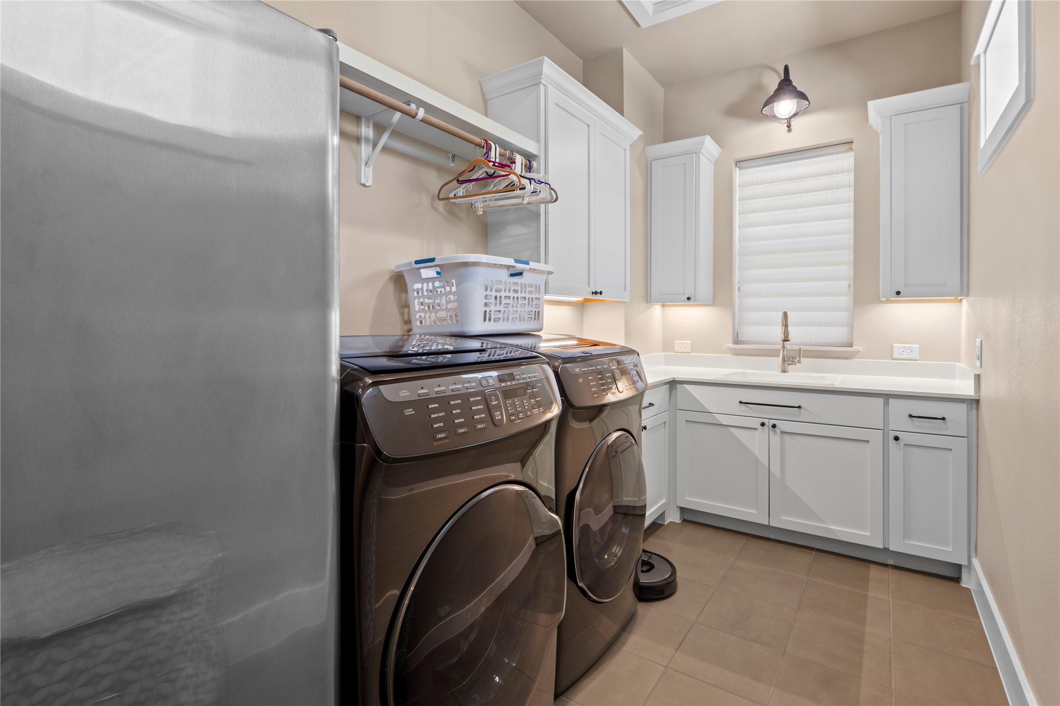 2004 Alegria Road Austin, TX 78757 - Photo 32 of 40 a utility room with sink dryer and washer