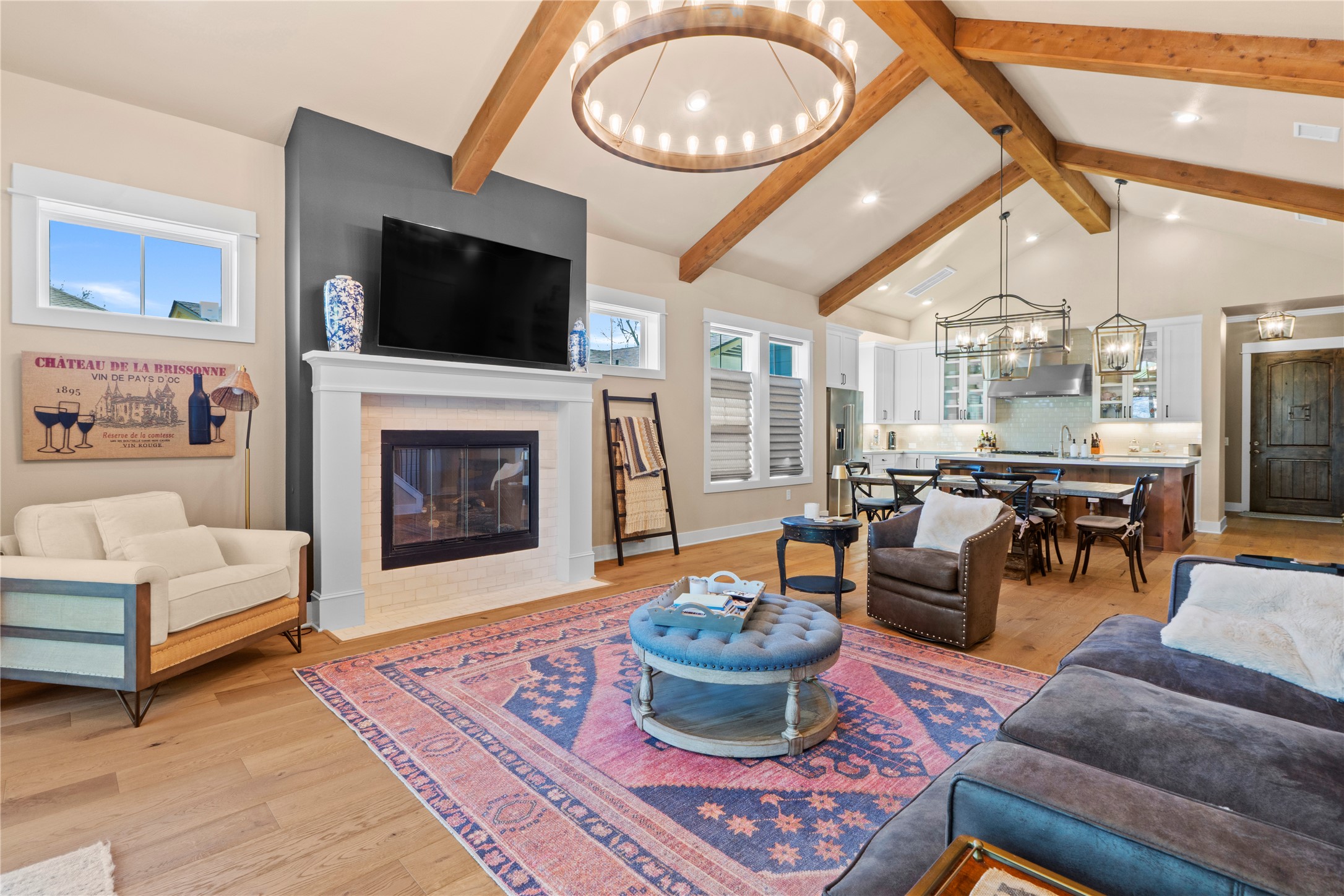 2004 Alegria Road Austin, TX 78757 - Photo 8 of 40 a living room with furniture a flat screen tv and a fireplace