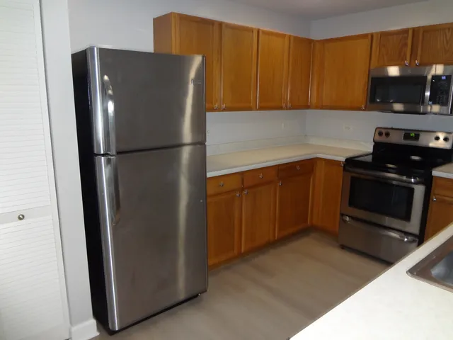 a white refrigerator freezer sitting in a kitchen