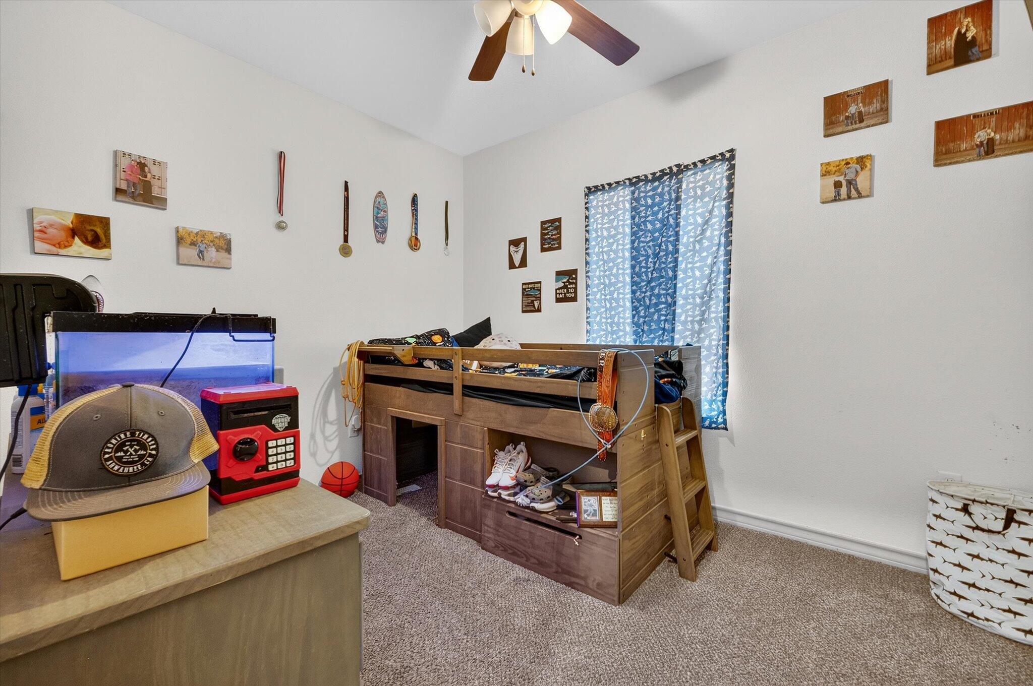 187 Allison Road Wilson, TX 79381 - Photo 19 of 35 a room with furniture and a baby crib