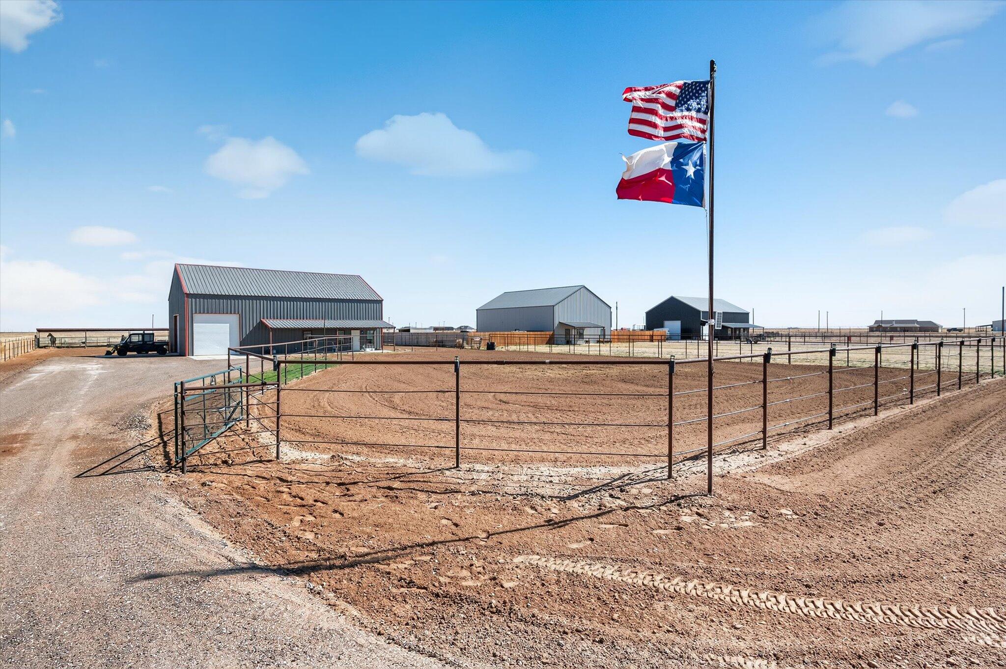 187 Allison Road Wilson, TX 79381 - Photo 33 of 35 a street sign on a road next to a building