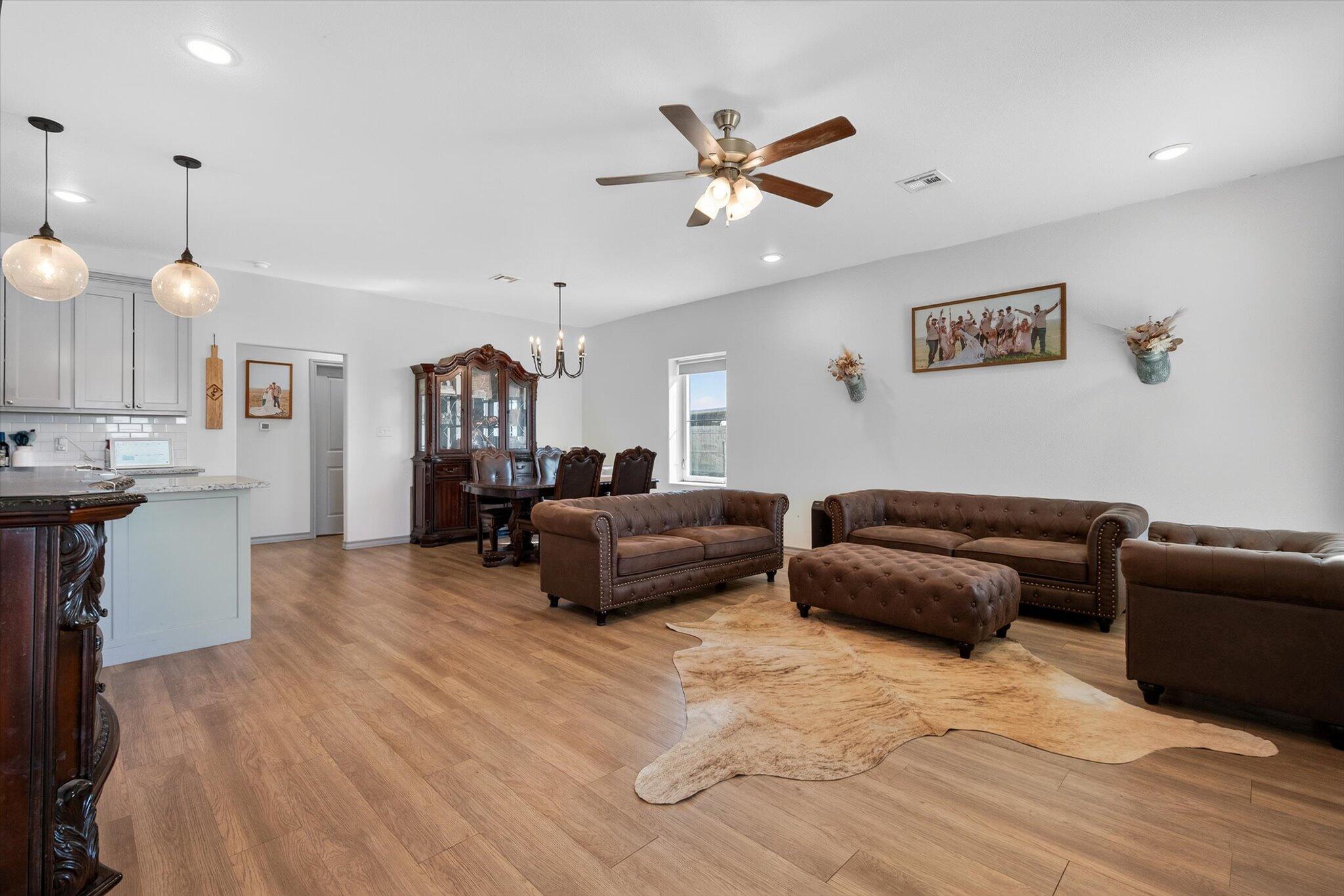 187 Allison Road Wilson, TX 79381 - Photo 5 of 35 a living room with furniture and a wooden floor