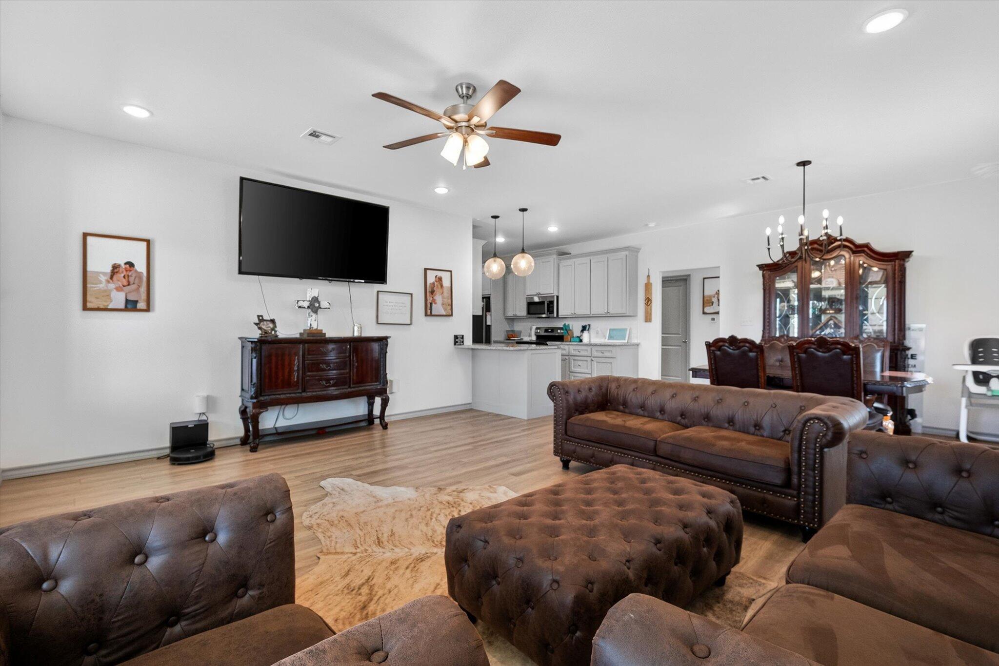187 Allison Road Wilson, TX 79381 - Photo 6 of 35 a living room with furniture and a flat screen tv