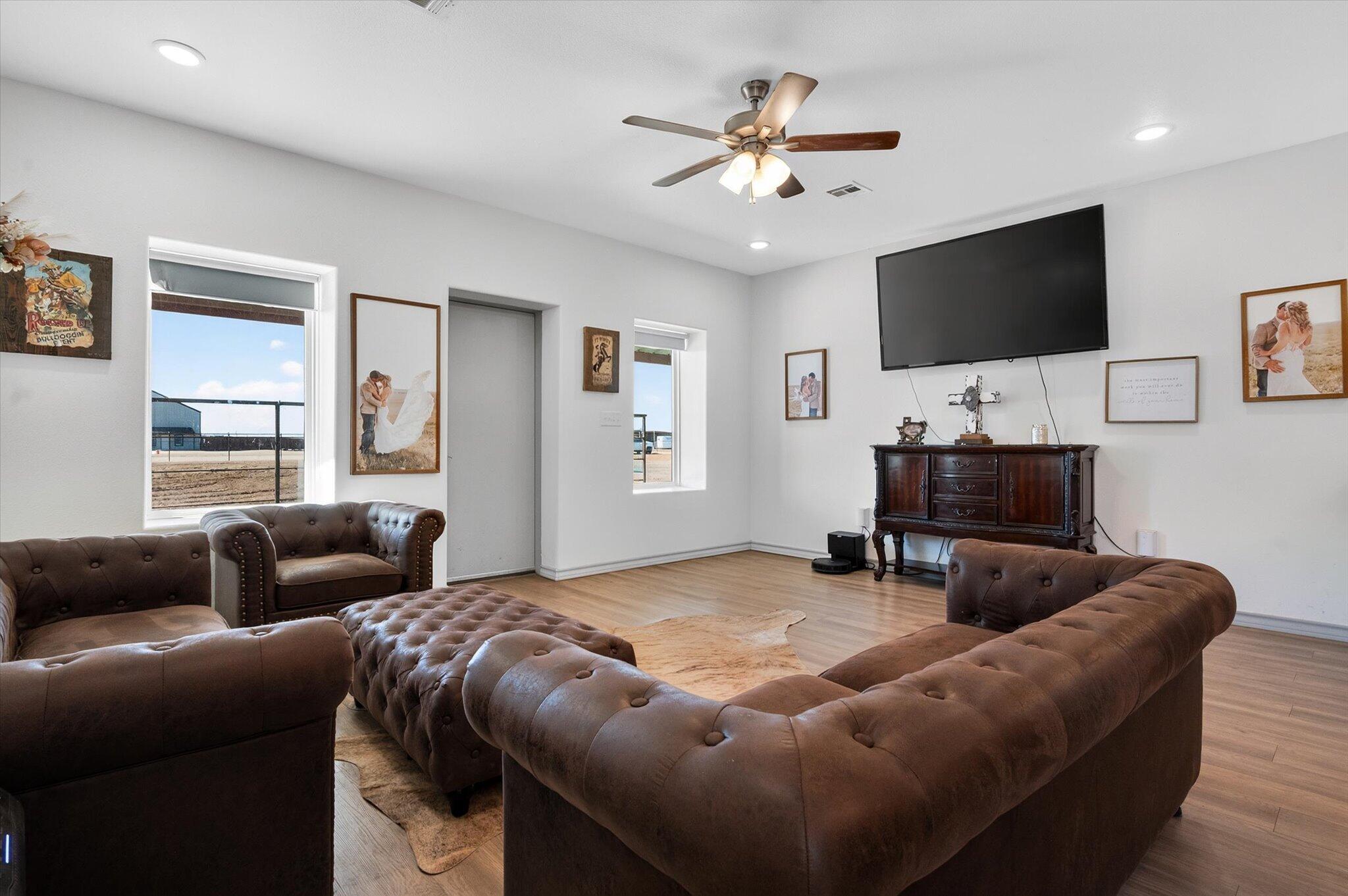 187 Allison Road Wilson, TX 79381 - Photo 7 of 35 a living room with furniture and a flat screen tv