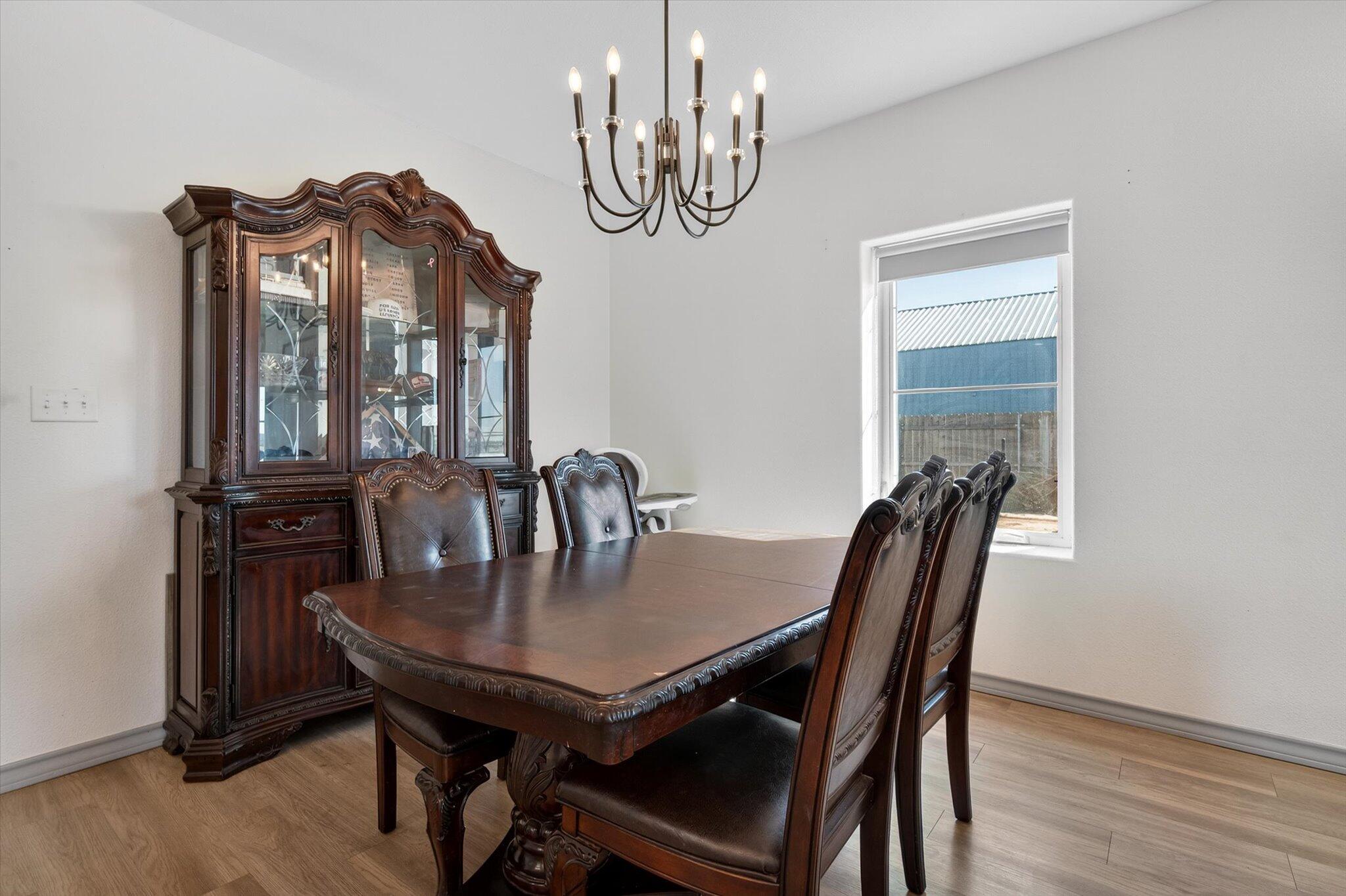 187 Allison Road Wilson, TX 79381 - Photo 9 of 35 a view of a dining room with furniture and window
