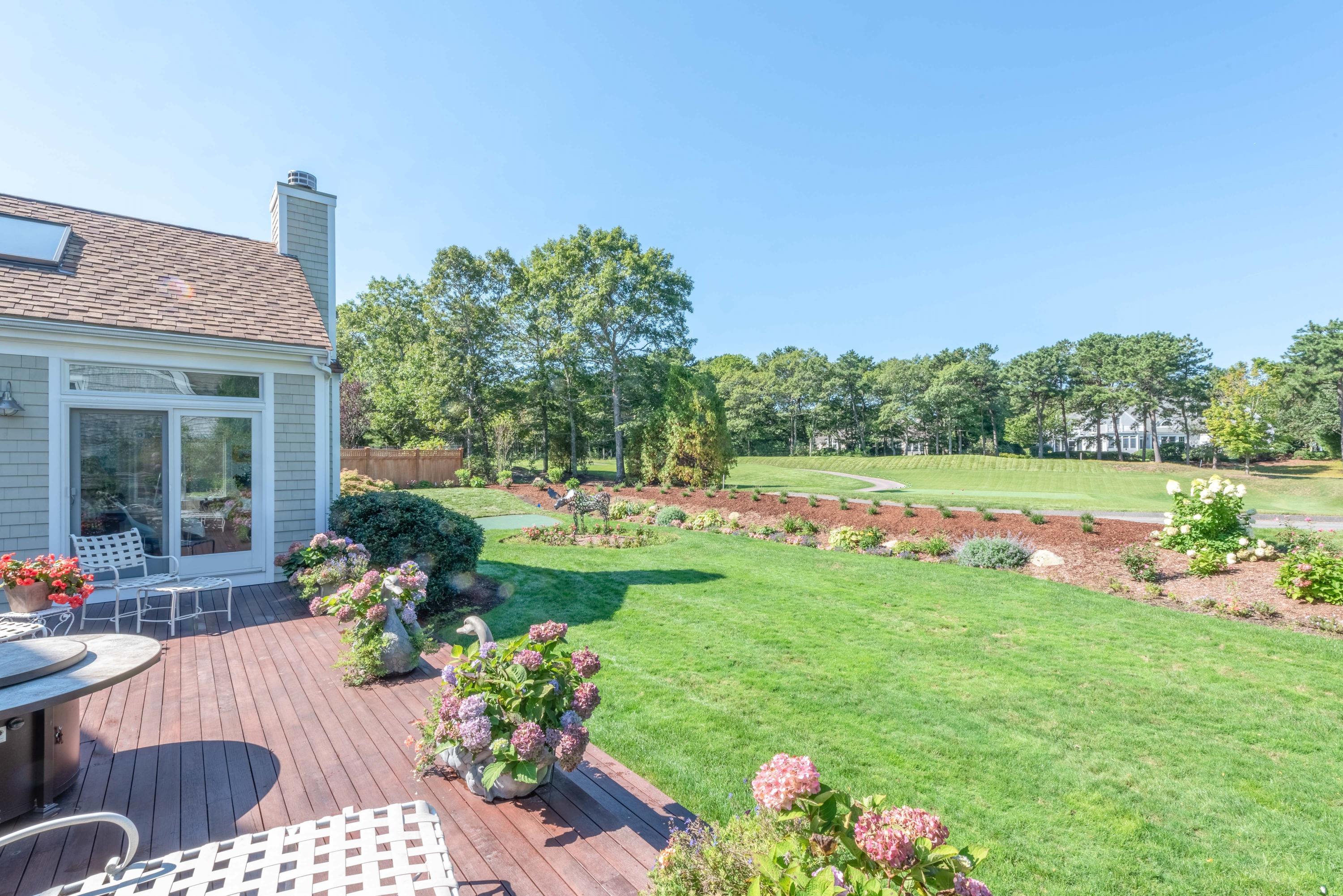 56 The Heights Mashpee, MA 02649 - Photo 16 of 16 a view of a house with backyard and garden