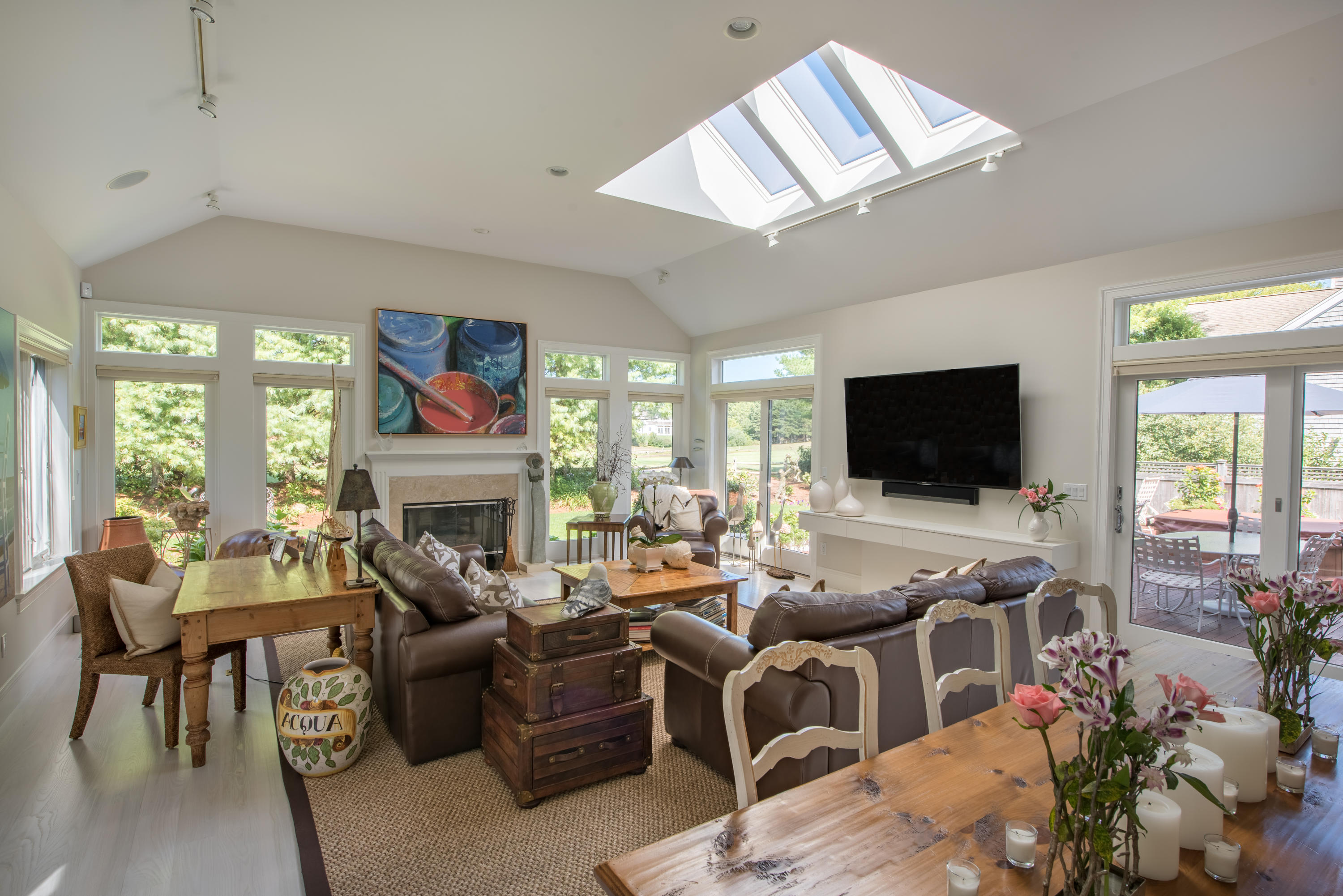 56 The Heights Mashpee, MA 02649 - Photo 4 of 16 a living room with fireplace furniture and a flat screen tv