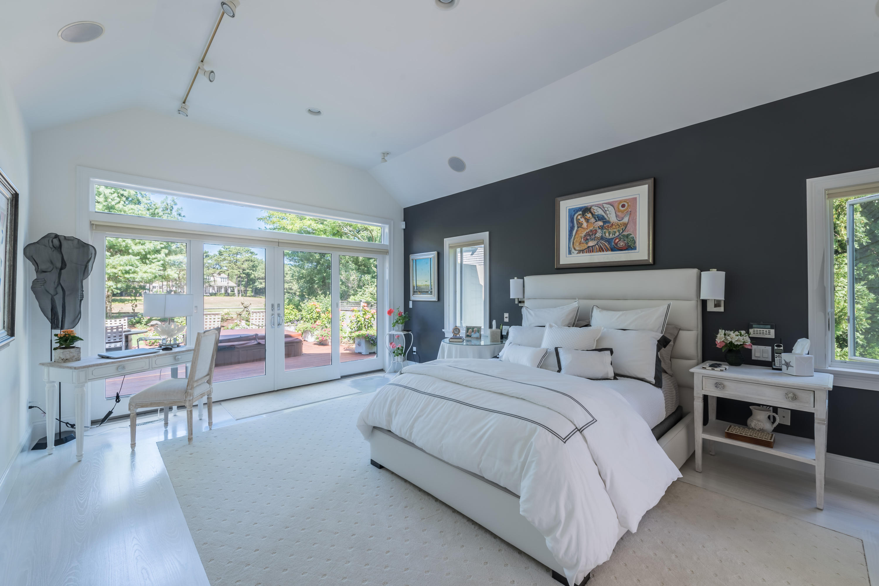 56 The Heights Mashpee, MA 02649 - Photo 8 of 16 a bedroom with a large bed and a large window