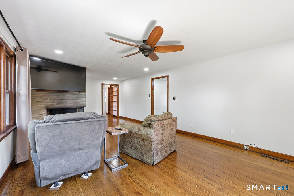 630 South Elm Street Wallingford, CT 06492 - Photo 13 of 30 a living room with furniture and a flat screen tv