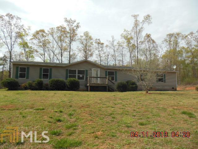 94 Riley Road Jefferson, GA 30549 - Photo 1 of 1 a front view of a house with a yard