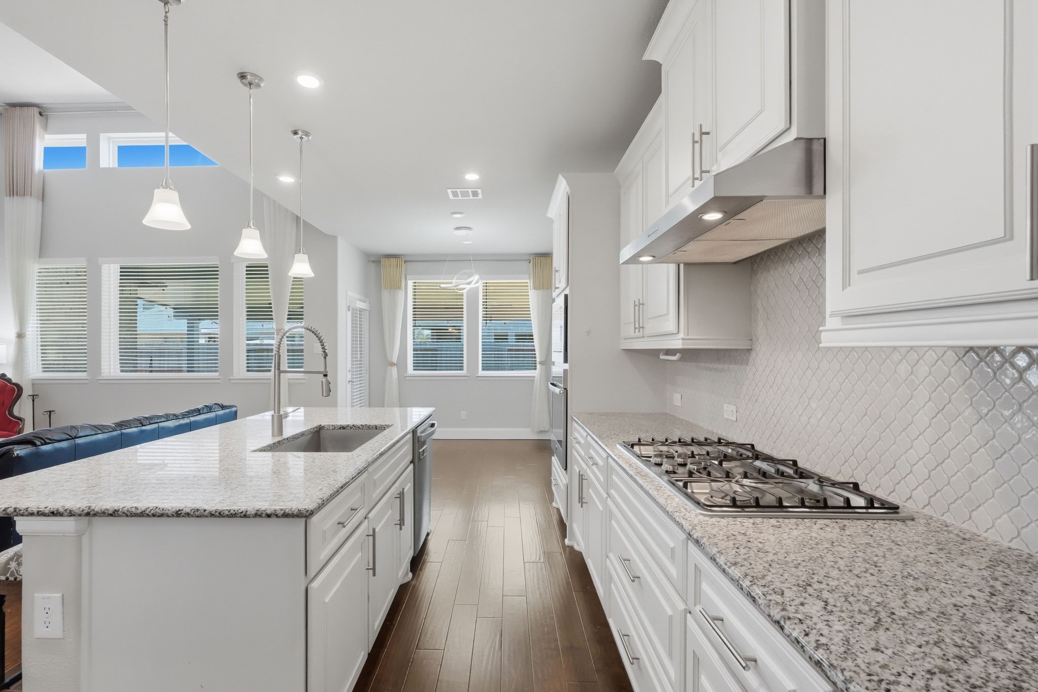 2809 Andante Green Drive Spring, TX 77386 - Photo 11 of 50 a kitchen with granite countertop a sink stove and cabinets