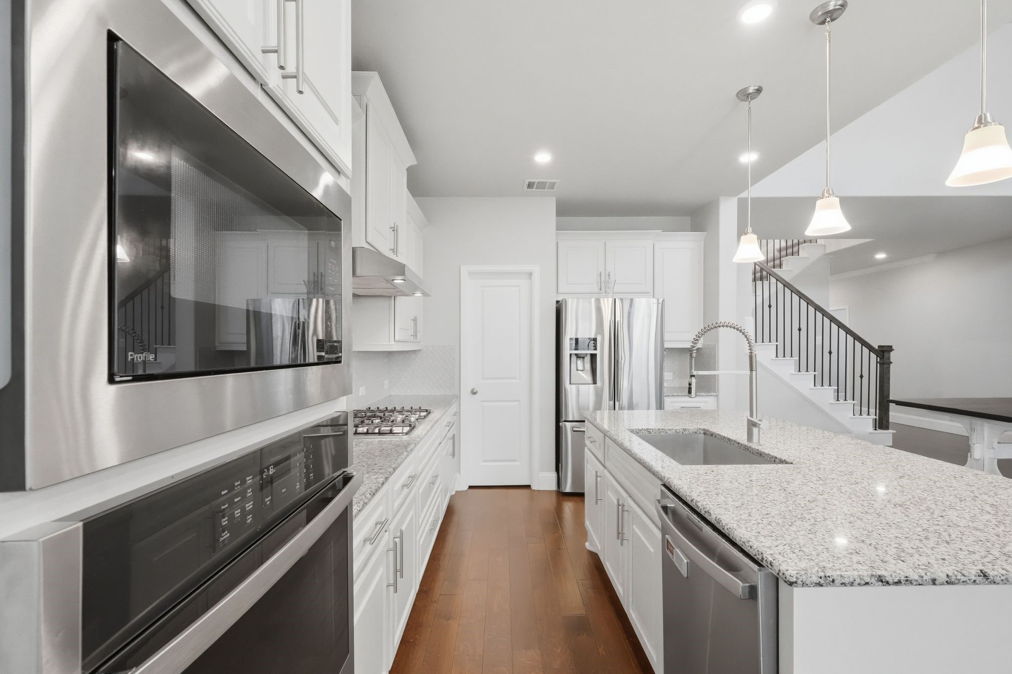 2809 Andante Green Drive Spring, TX 77386 - Photo 12 of 50 a kitchen with stainless steel appliances granite countertop a sink and stove