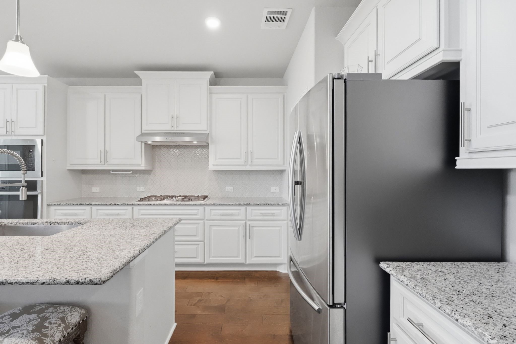 2809 Andante Green Drive Spring, TX 77386 - Photo 13 of 50 a kitchen with stainless steel appliances granite countertop a refrigerator and a stove