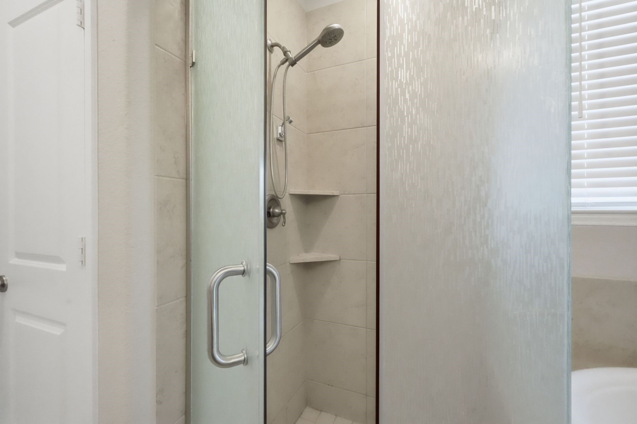 2809 Andante Green Drive Spring, TX 77386 - Photo 19 of 50 a bathroom with a glass shower door