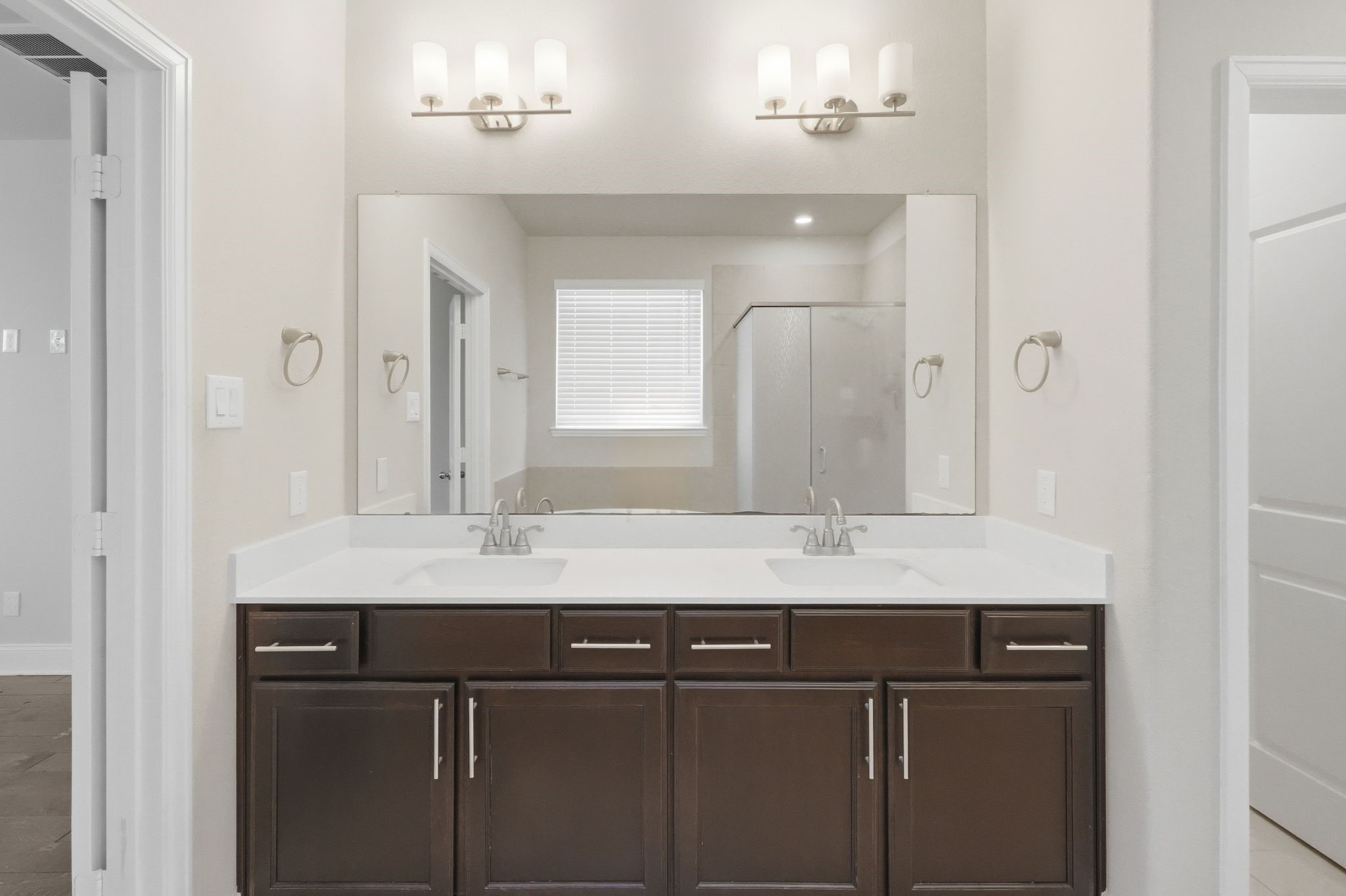2809 Andante Green Drive Spring, TX 77386 - Photo 21 of 50 a bathroom with a granite countertop sink a mirror and a shower