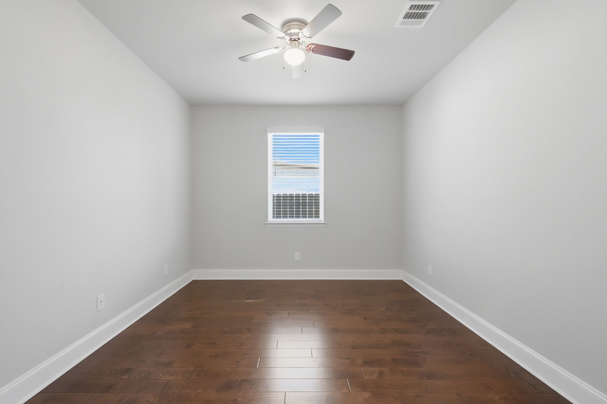 2809 Andante Green Drive Spring, TX 77386 - Photo 23 of 50 wooden floor in an empty room with a window