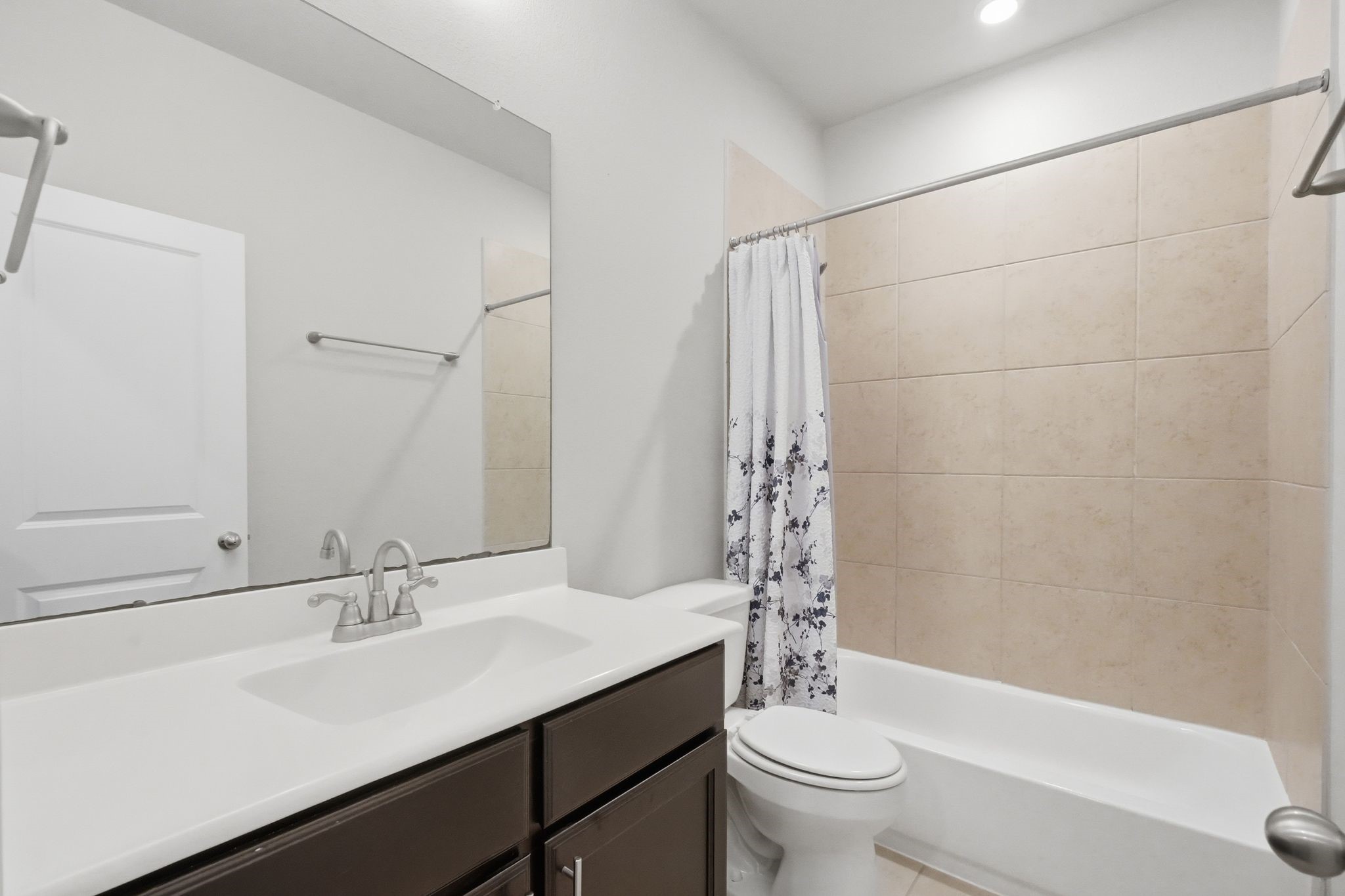 2809 Andante Green Drive Spring, TX 77386 - Photo 38 of 50 a bathroom with a sink a toilet a mirror a vanity and shower