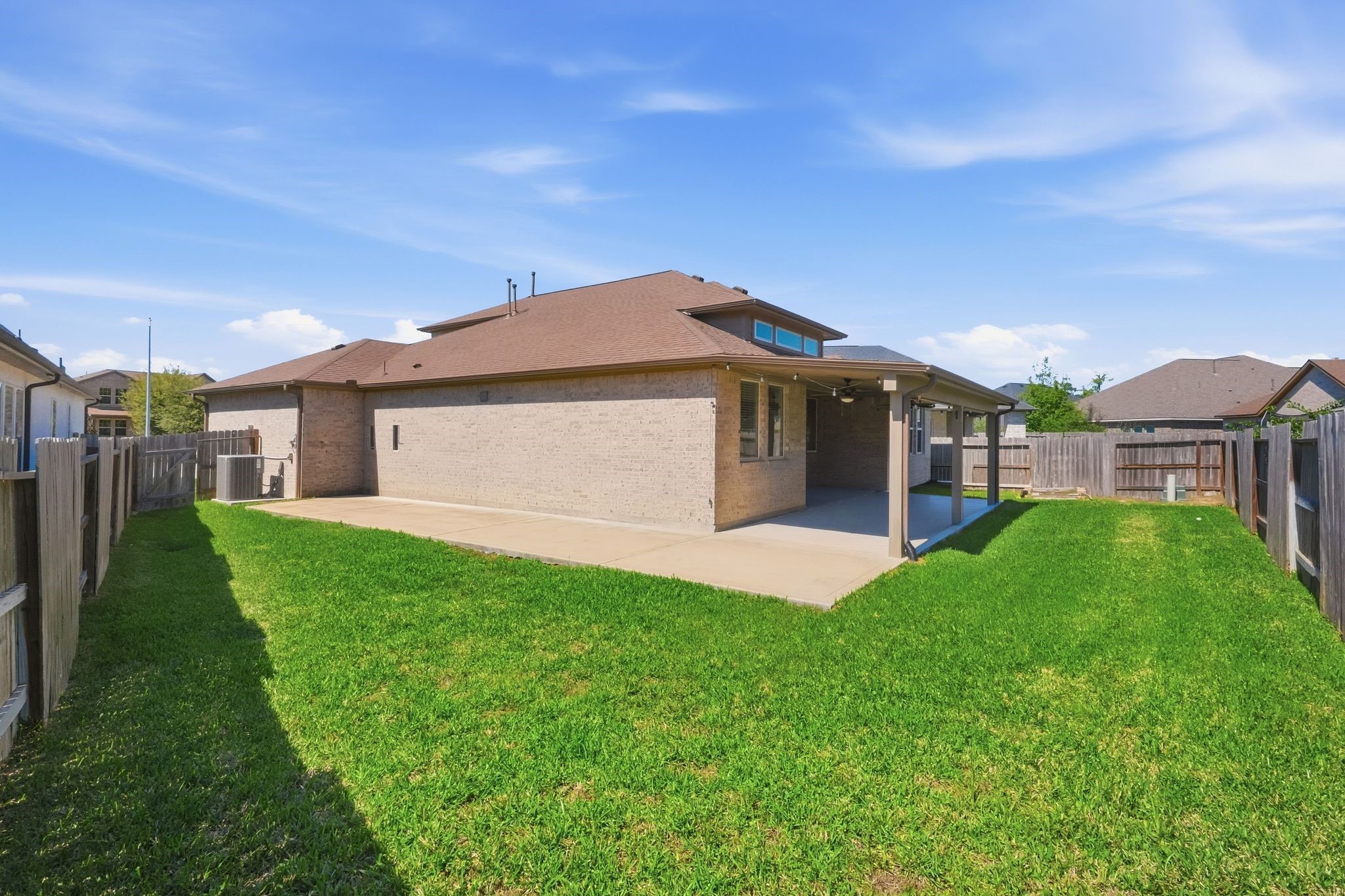 2809 Andante Green Drive Spring, TX 77386 - Photo 45 of 50 a front view of a house with a garden and yard