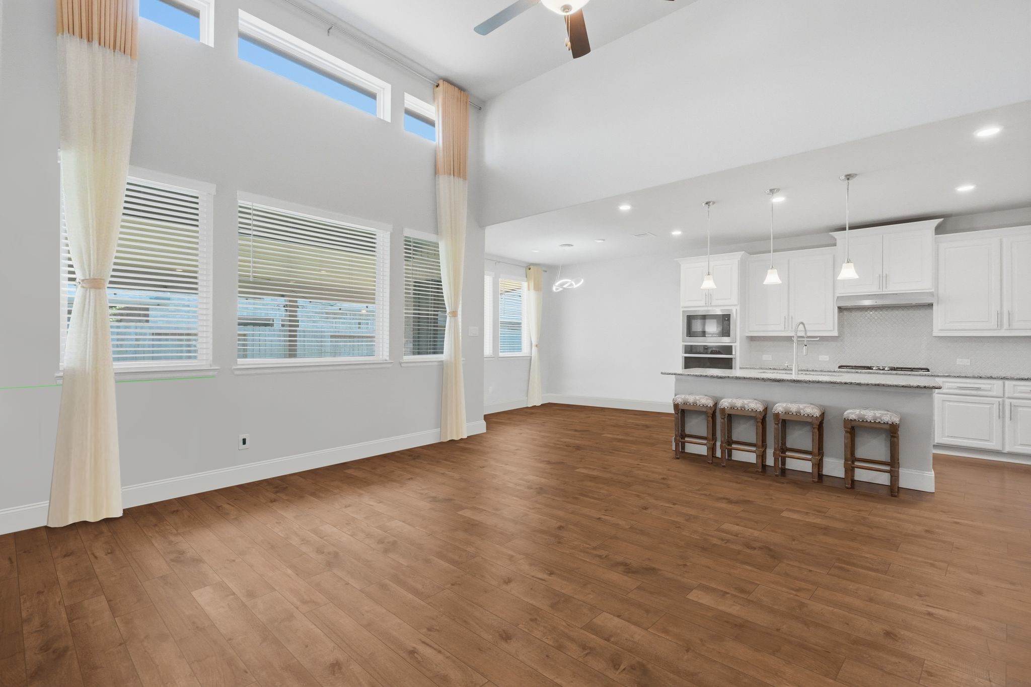 2809 Andante Green Drive Spring, TX 77386 - Photo 8 of 50 a view of kitchen with window and wooden floor