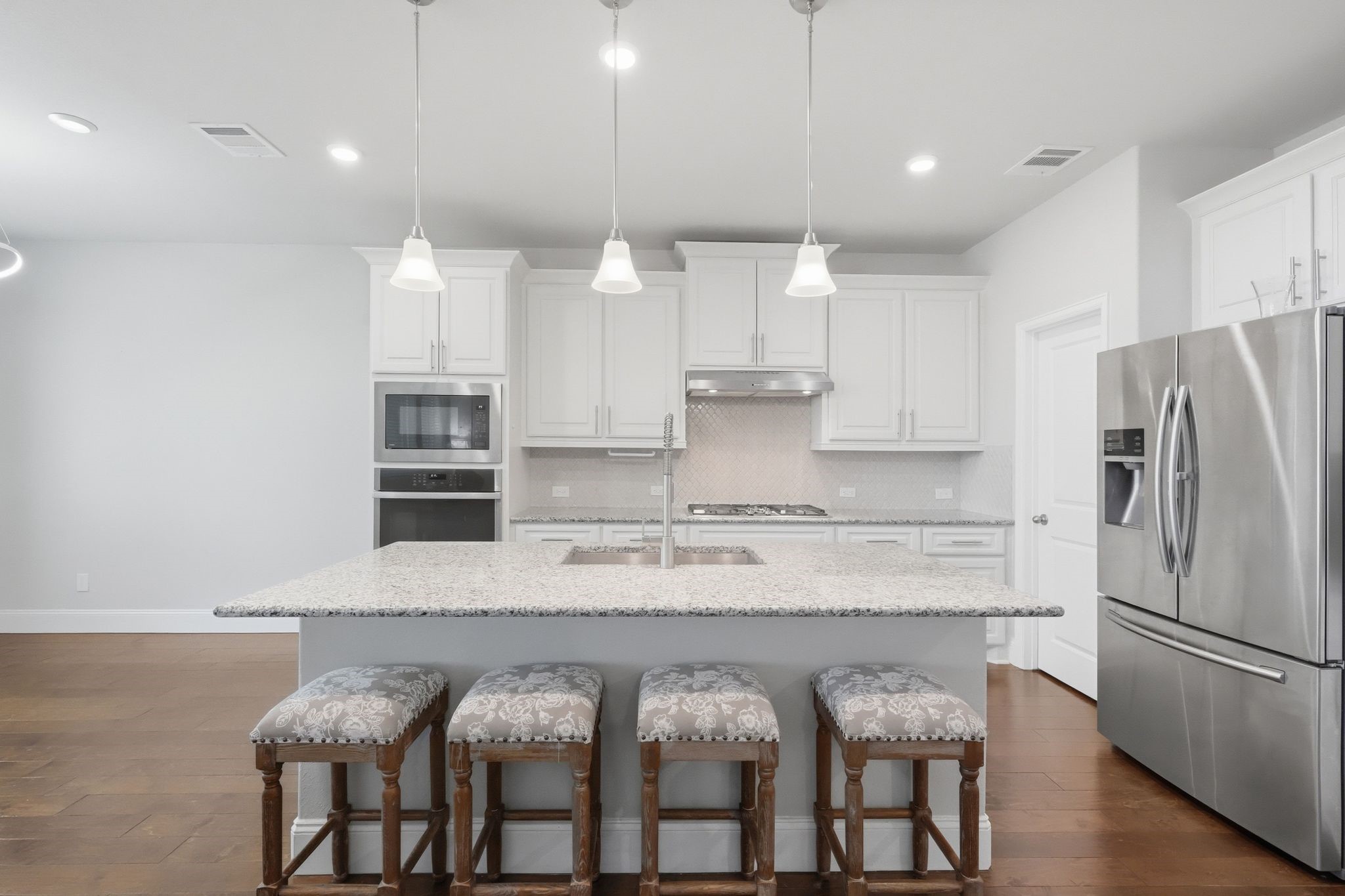 2809 Andante Green Drive Spring, TX 77386 - Photo 9 of 50 a kitchen with stainless steel appliances granite countertop a refrigerator and a stove top oven