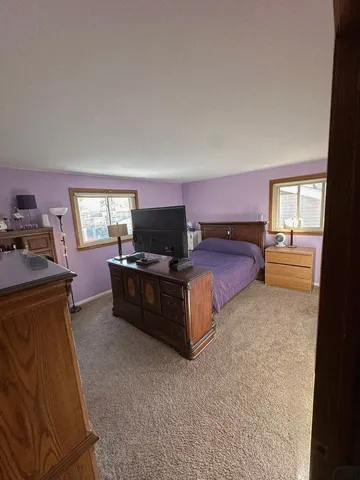 a bedroom with furniture and window