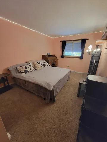 a view of a patio with table and chairs and potted plants