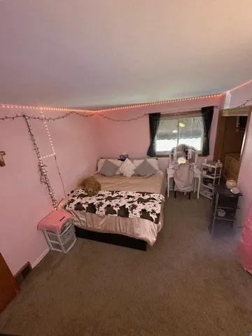 a utility room with a sink a stove and cabinets