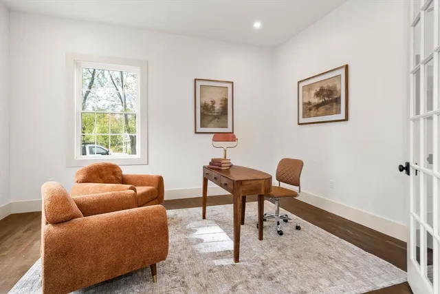 a living room with furniture a window and a fireplace