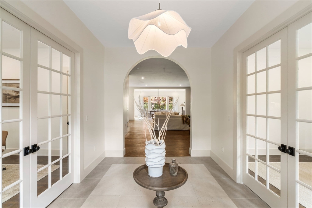 31 Porter Road Andover, MA 01810 - Photo 2 of 42 a dining room with chandelier and outdoor space