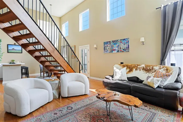 a living room with furniture or stairs and a rug
