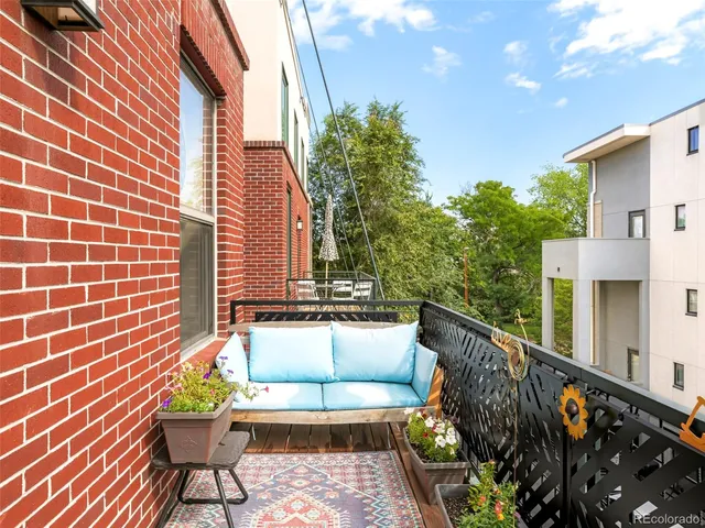 a view of balcony with outdoor seating and stairs