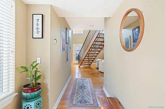 a view of entryway with wooden floor