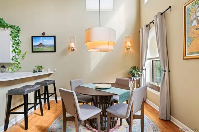 a view of a dining room with furniture and window